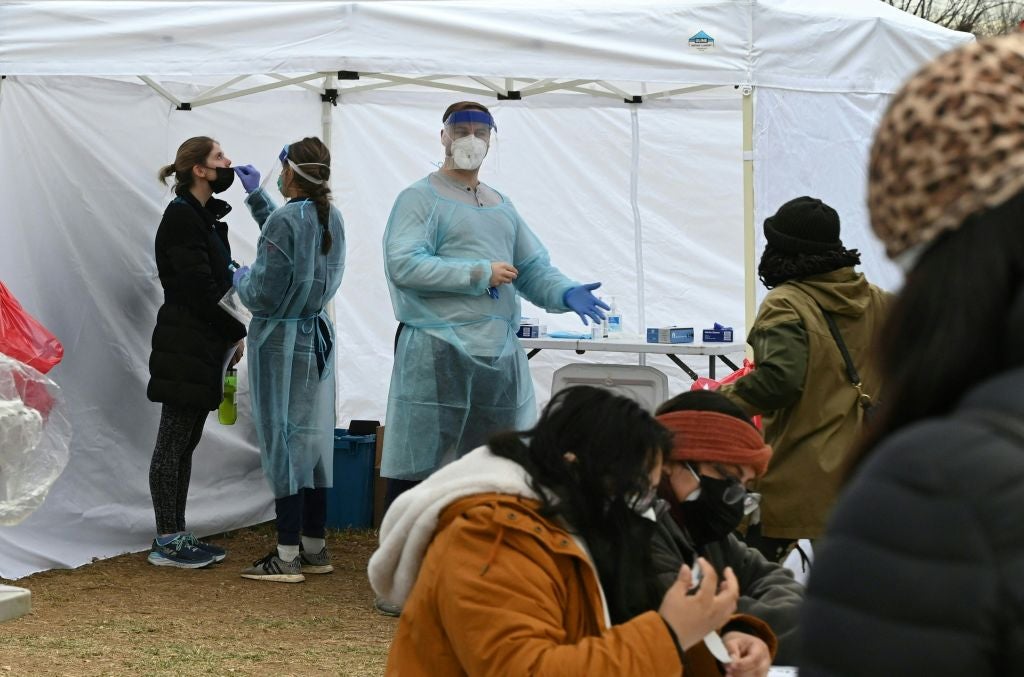 People get tested for Covid-19 at a testing site in Washington, DC
