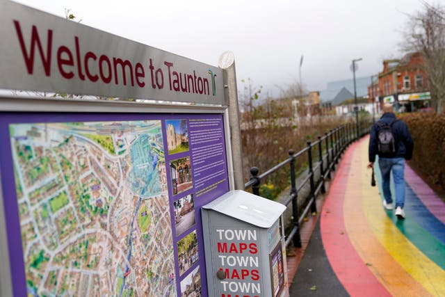A man walks past a Welcome to Taunton sign in Taunton, Somerset, as the town has been identified as the UK’s top house price hotspot in 2021 (Andrew Matthews/PA)