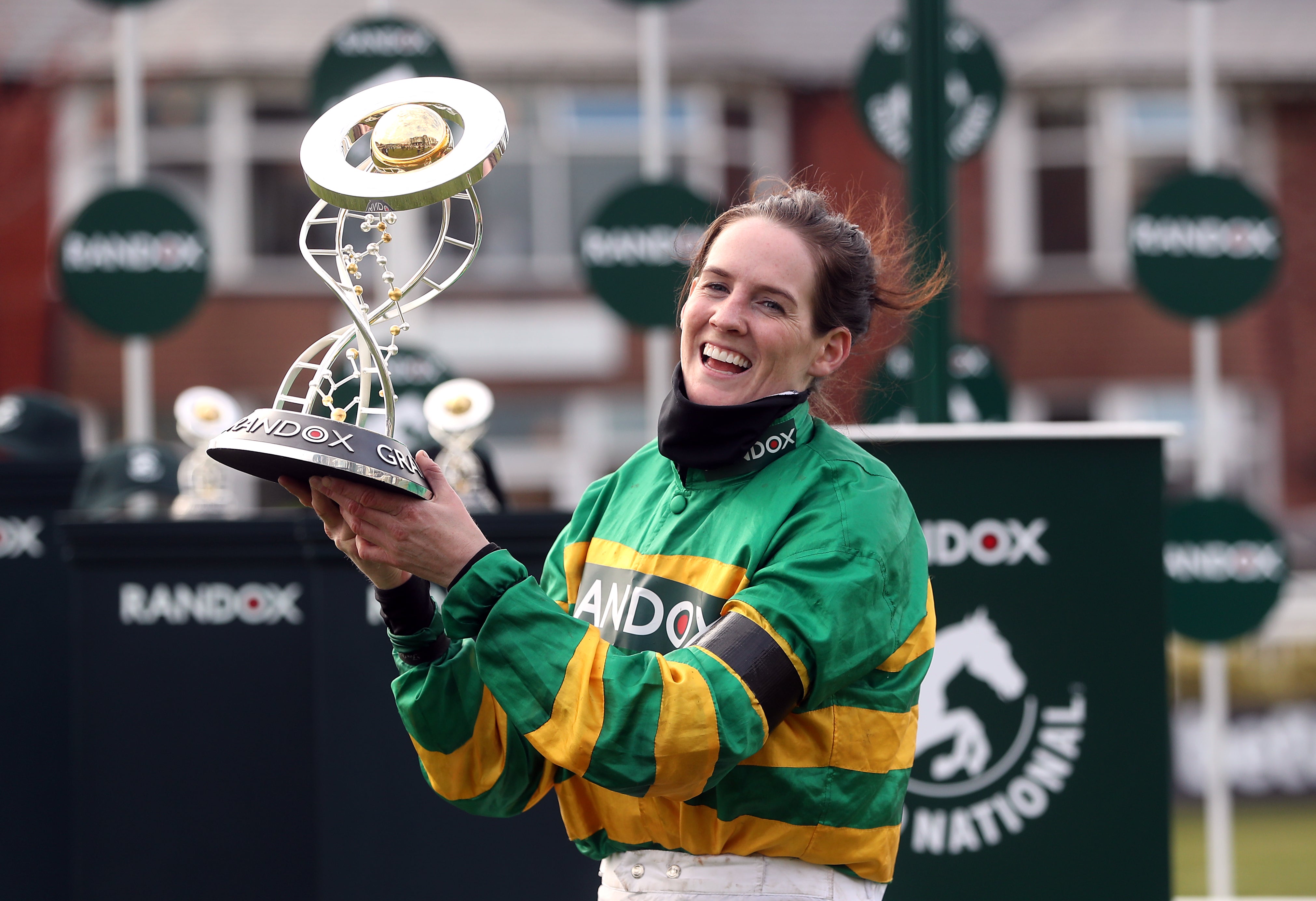 Jockey Rachael Blackmore receives the Randox Grand National Handicap Chase trophy after winning on Minella Times at Aintree Racecourse, Liverpool (David Davies/PA)
