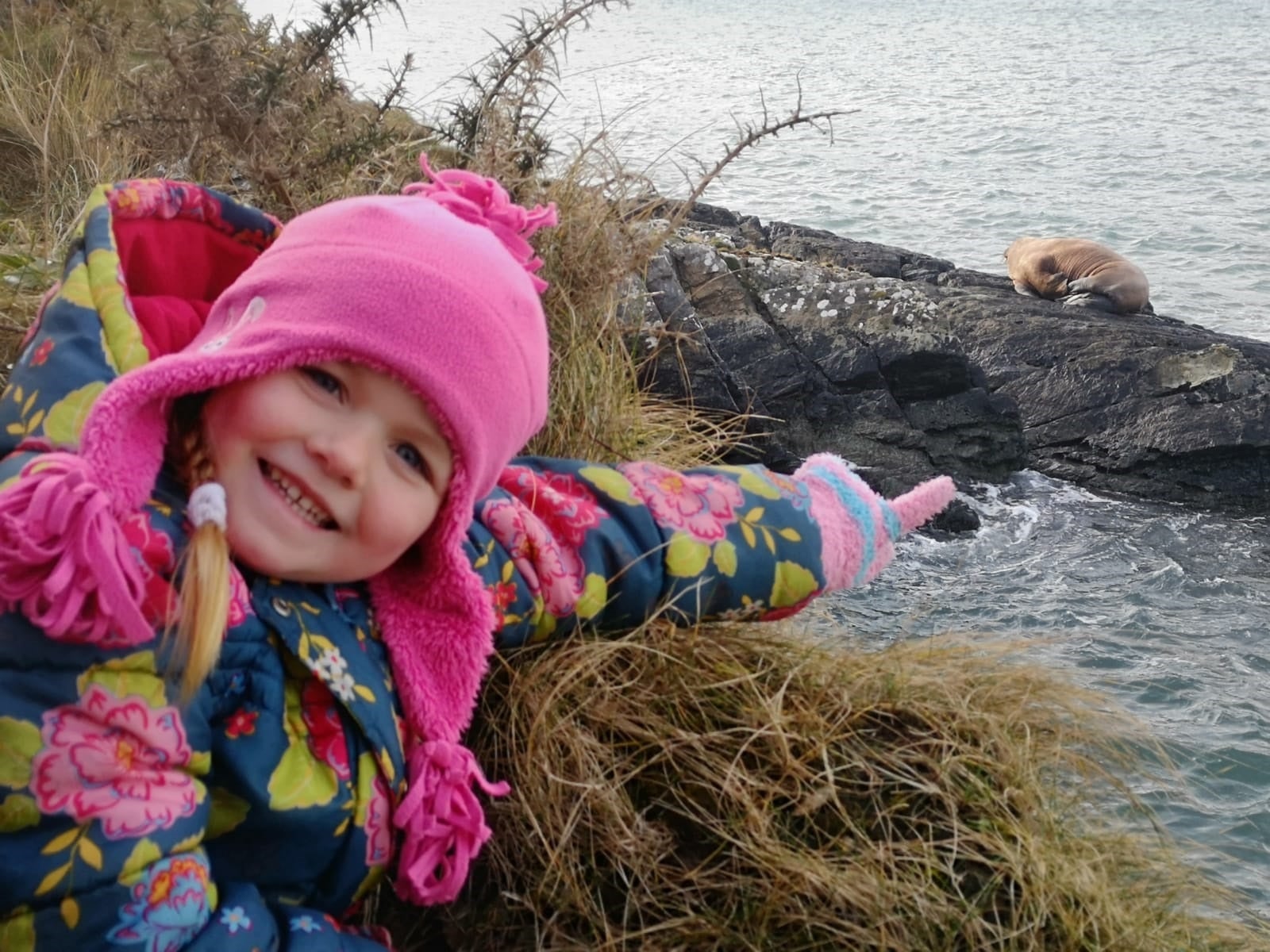 Five-year-old Muireann Houlihan with the walrus she spotted along the coast of Valentia Island, Co Kerry (Alan Houlihan/PA)