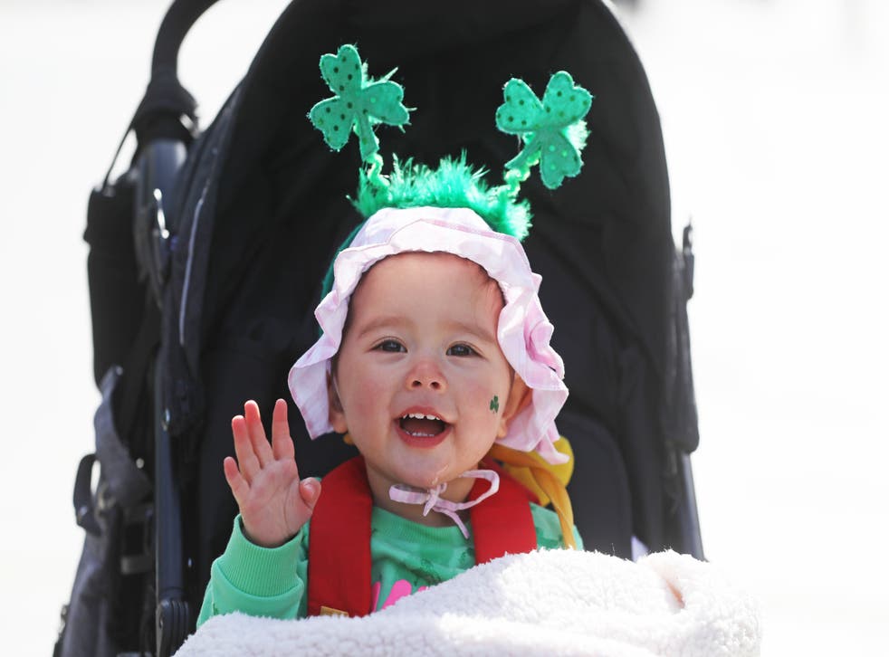 Eighteen-month-old Grace Wang dressed up to celebrate St Patrick’s Day on O’Connell Street in Dublin on March 17 2021 (Brian Lawless/PA)