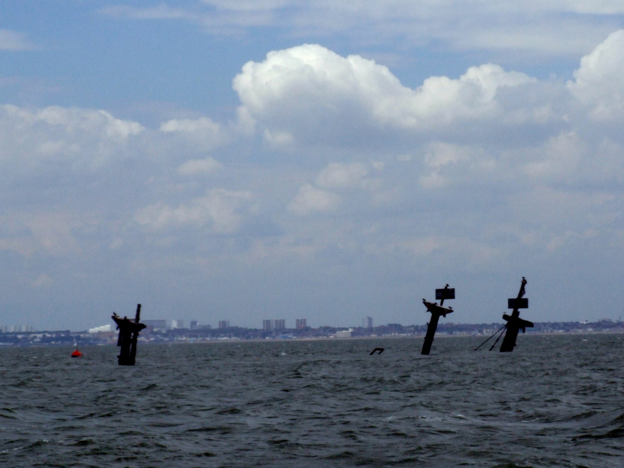 The masts of the SS Richard Montgomery protrude above the surface in the Thames estuary