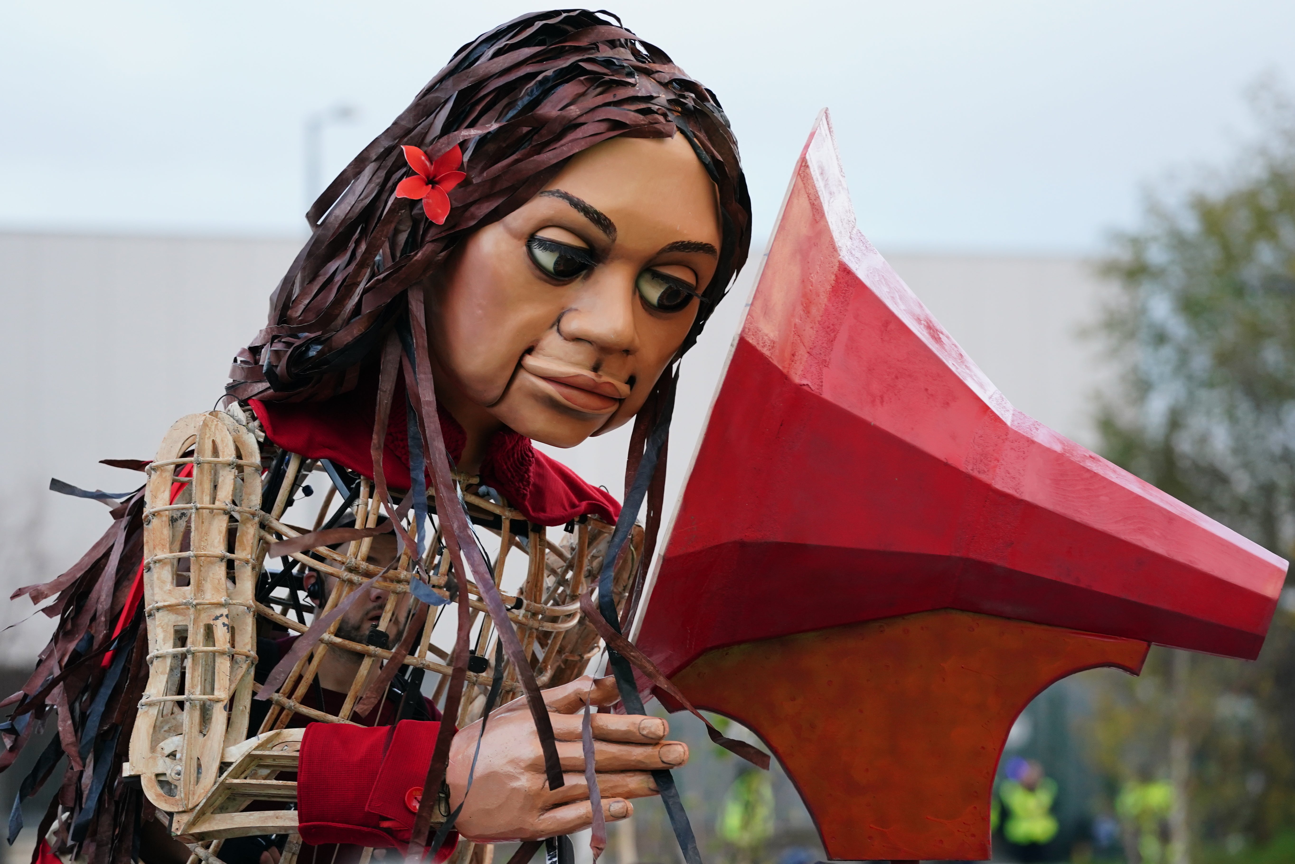 Puppet Little Amal visits the green zone at Cop26 summit at the Scottish Event Campus (SEC) in Glasgow for the opening of the Gender Day event (Jane Barlow/PA)