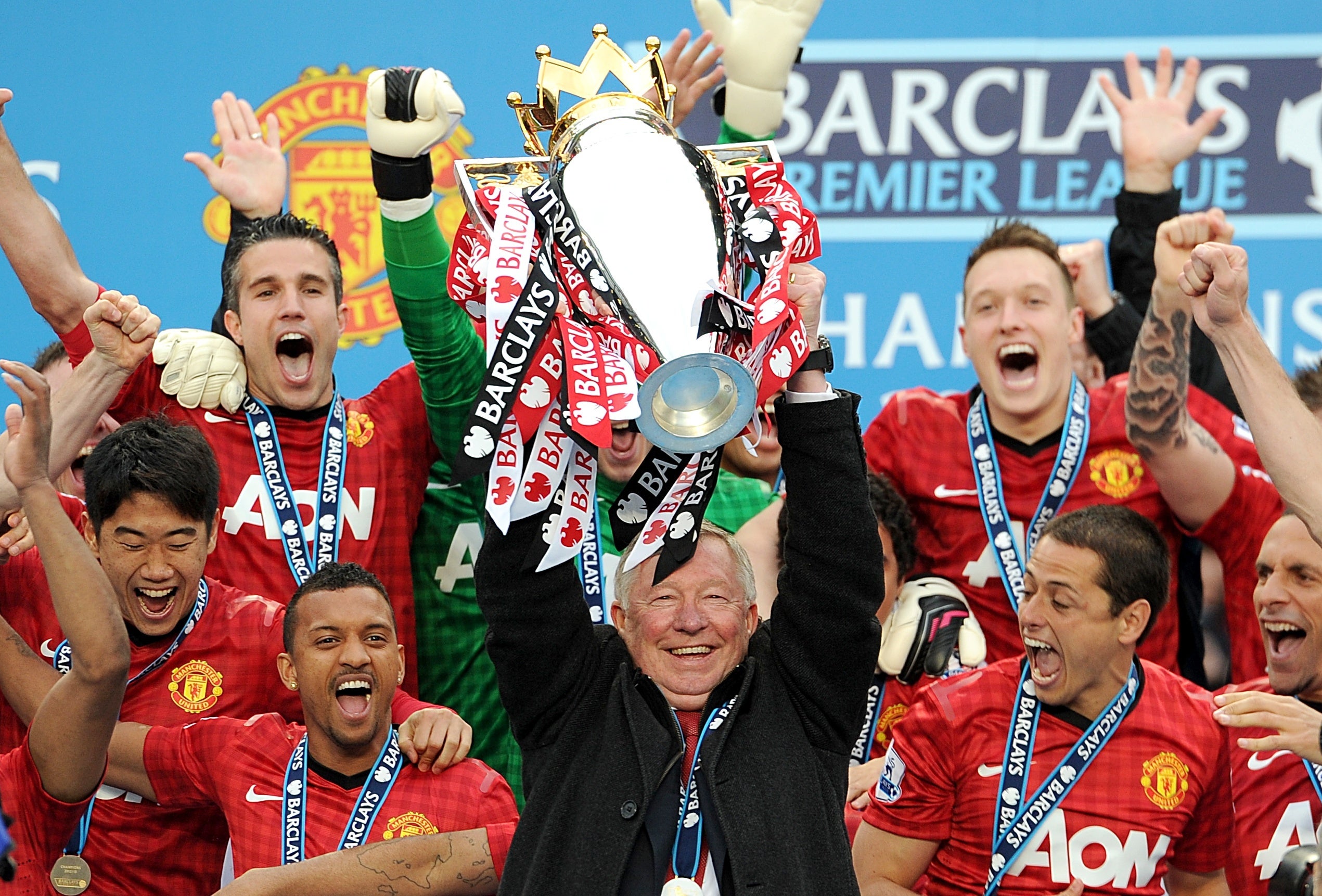 Sir Alex Ferguson lifts the Premier League trophy (Martin Rickett/PA)