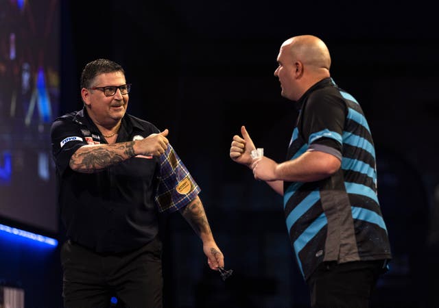 Two-time world champion Gary Anderson celebrates after his 4-3 victory over Rob Cross (Steven Paston/PA)