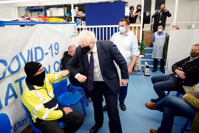 Prime Minister Boris Johnson set a target for all adults in England to be offered a booster jab by the end of the year (Peter Byrne/PA)