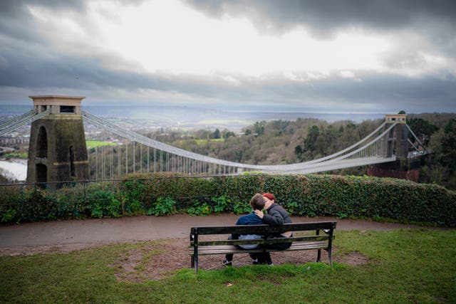 People sit on benches in Clifton, Bristol (Ben Birchall/PA)