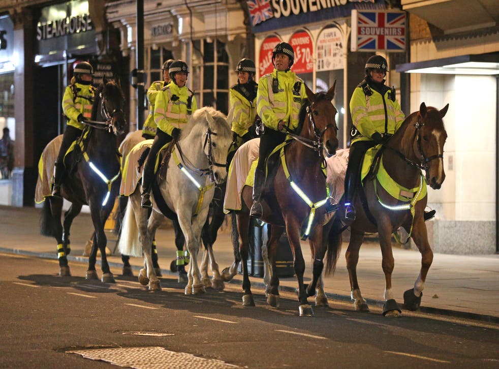 Mounted police in central London, where the New Year’s Eve fireworks display has been cancelled (Jonathan Brady/PA)