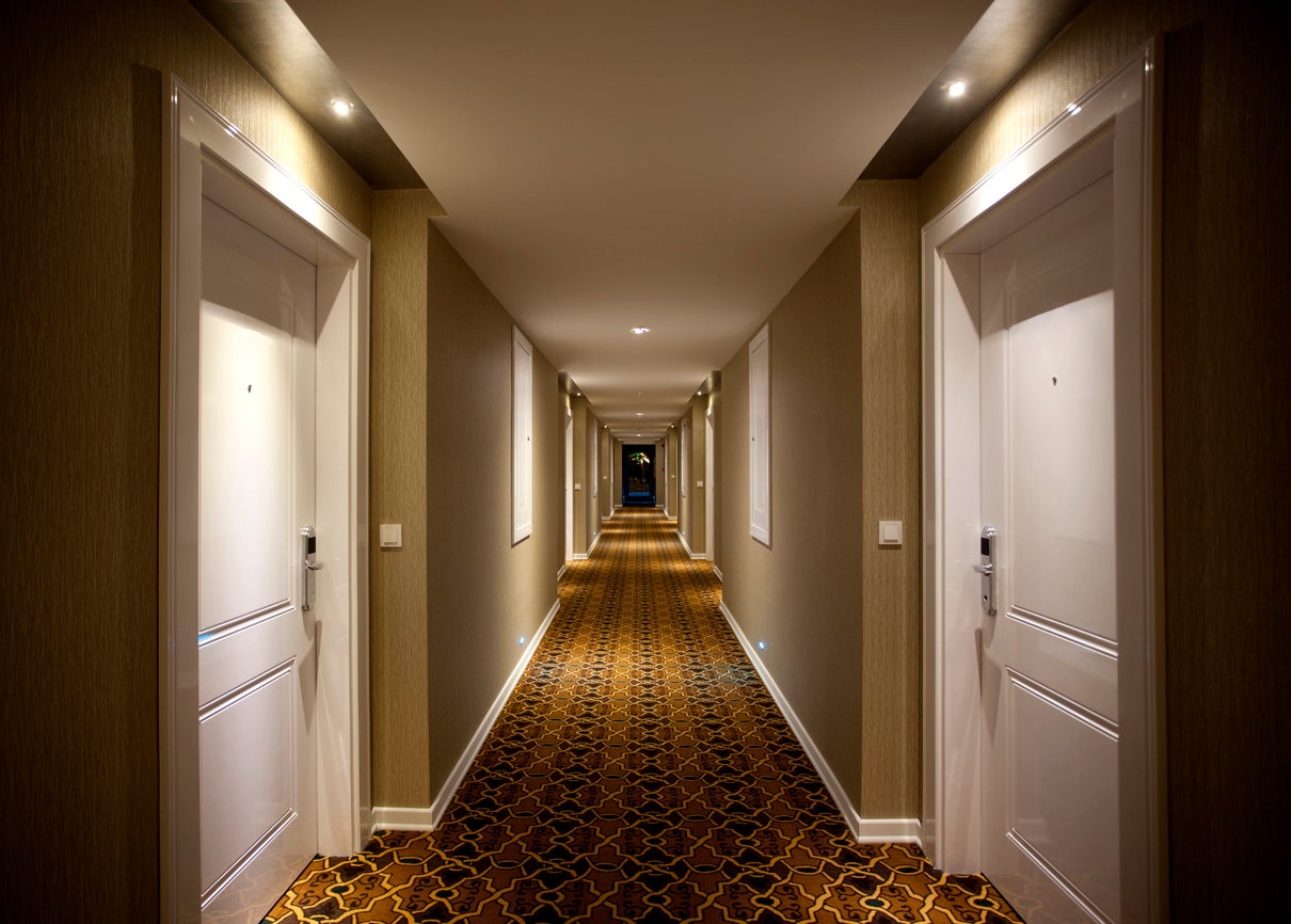 Particles can escape hotel room doors and cross corridors, researchers say