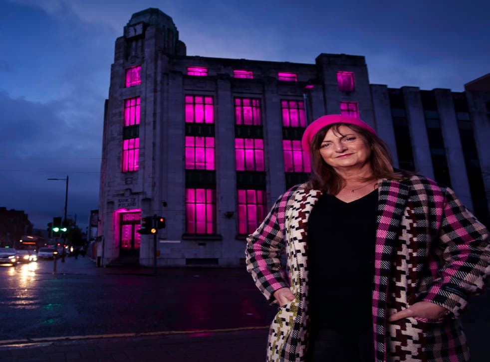 Singer-songwriter Brigid O’Neill outside the art deco former Bank of Ireland building in Belfast city centre, which she has written a song about (Brian Morrison/PA)