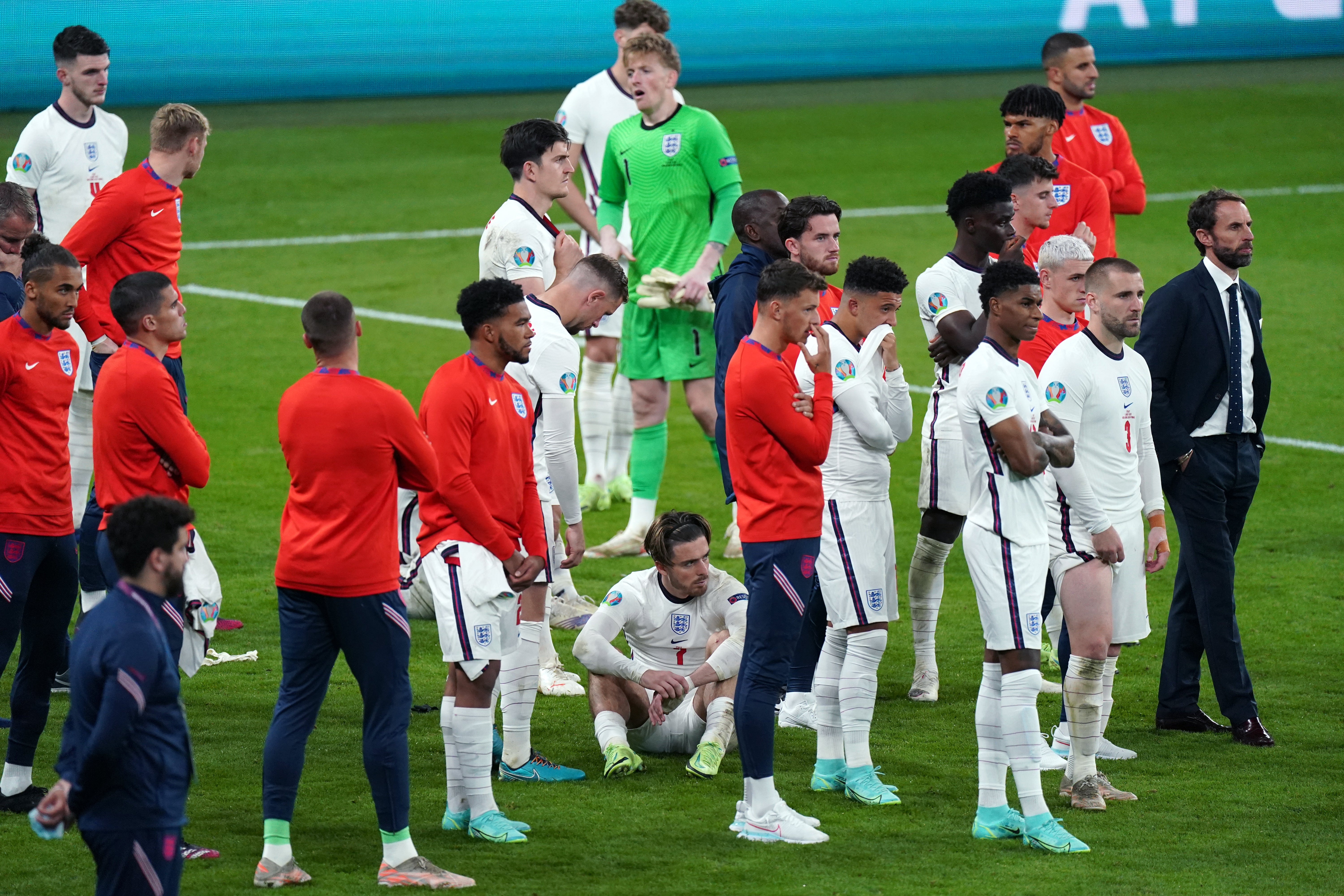 England’s players are crest-fallen after losing to Italy on penalties in the Euro 2020 final at Wembley (Mike Egerton/PA)