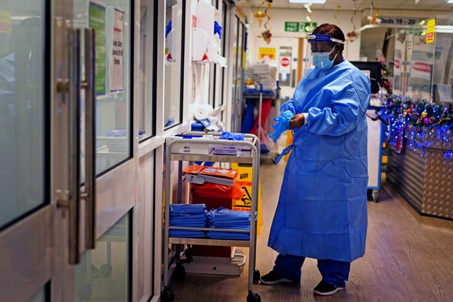 A nurse working on a Covid ward in a hospital (Victoria Jones/PA)