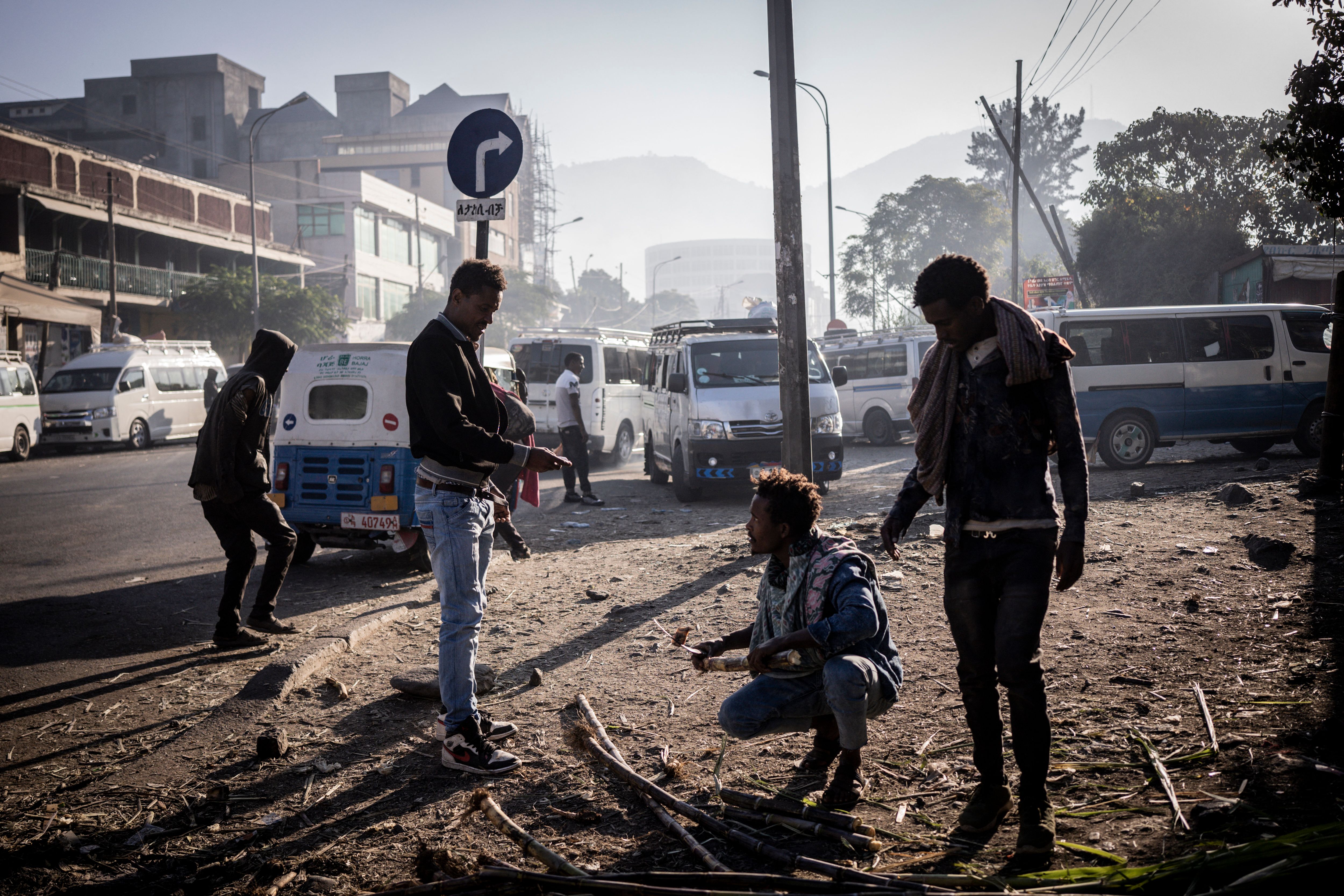 People trade wood in the streets of Kombolcha, Ethiopia, in December