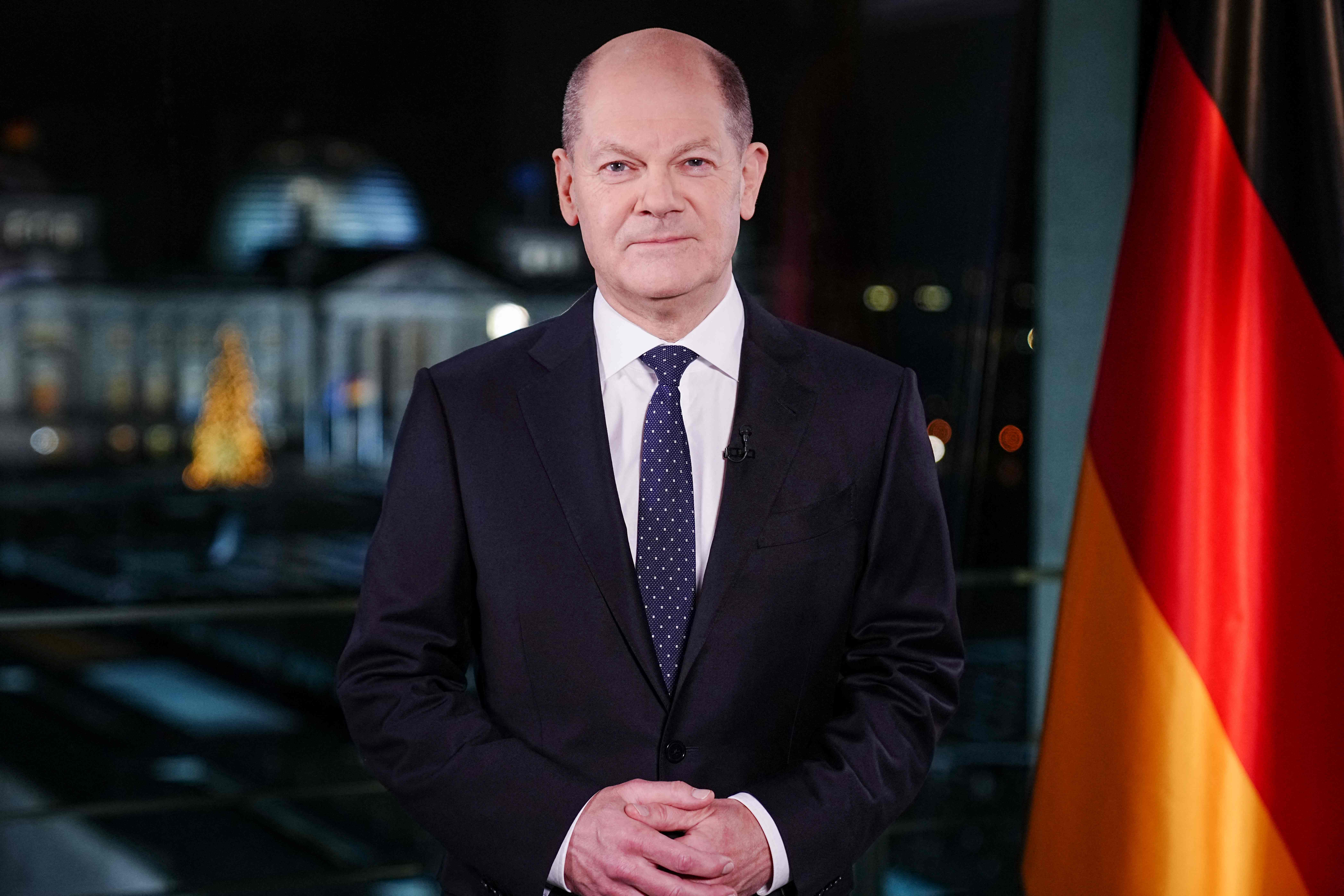 German Chancellor Olaf Scholz poses for photographs in occasion of the recording of his New Year's speech at the chancellery in Berlin