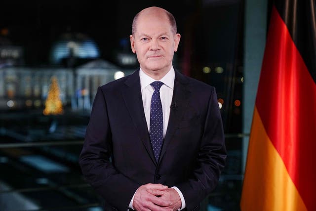 <p>German Chancellor Olaf Scholz poses for photographs in occasion of the recording of his New Year's speech at the chancellery in Berlin</p>