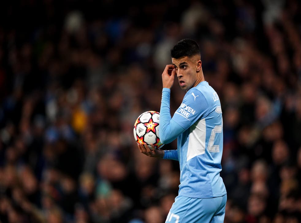 Joao Cancelo is set to travel with Manchester City to London (Zac Goodwin/PA)