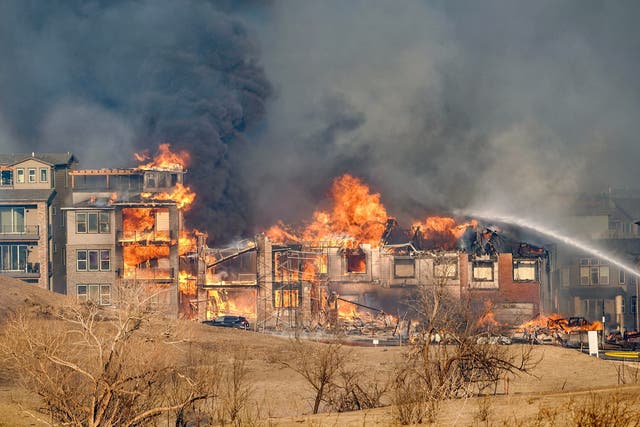 <p>Structures burn as a wind-driven wildfire forced evacuation of the Superior suburb of Boulder, Colorado</p>
