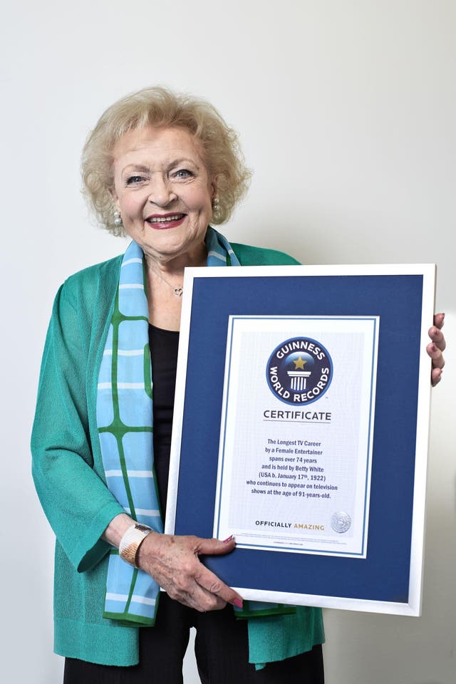 Betty White holds her Guinness World Records certificate (PA)