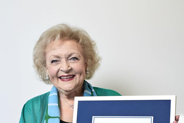 Betty White holds her Guinness World Records certificate (PA)