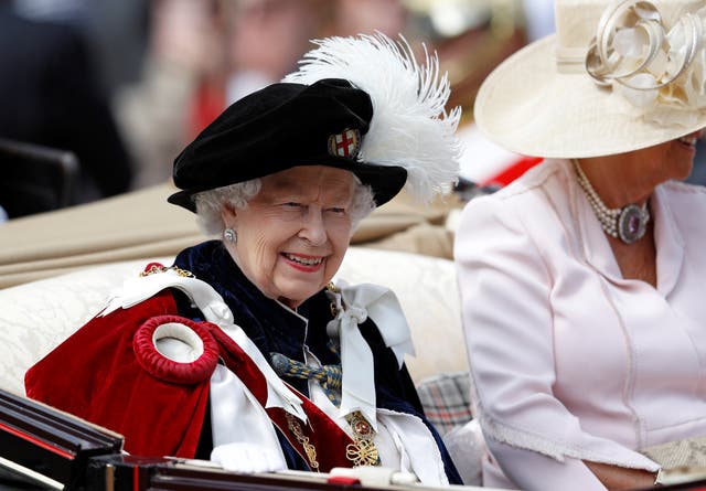 <p>Queen Elizabeth II travels in a carriage as she leaves the Order of the Garter Service at Windsor Castle in 2019 (Peter Nicholls/PA)</p>