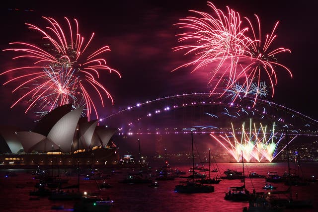 <p>Fireworks explode over the Sydney Opera House and Harbour Bridge as New Year's Eve celebrations begin in Sydney</p>