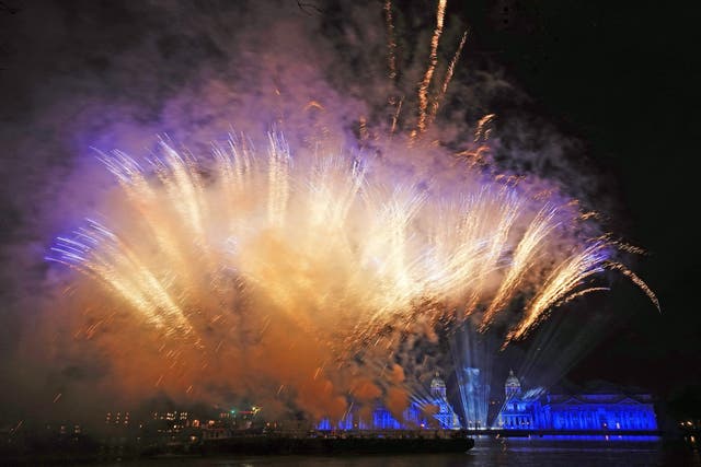 Fireworks illuminate the night sky over the Old Royal Naval College in London (Aaron Chown/PA)