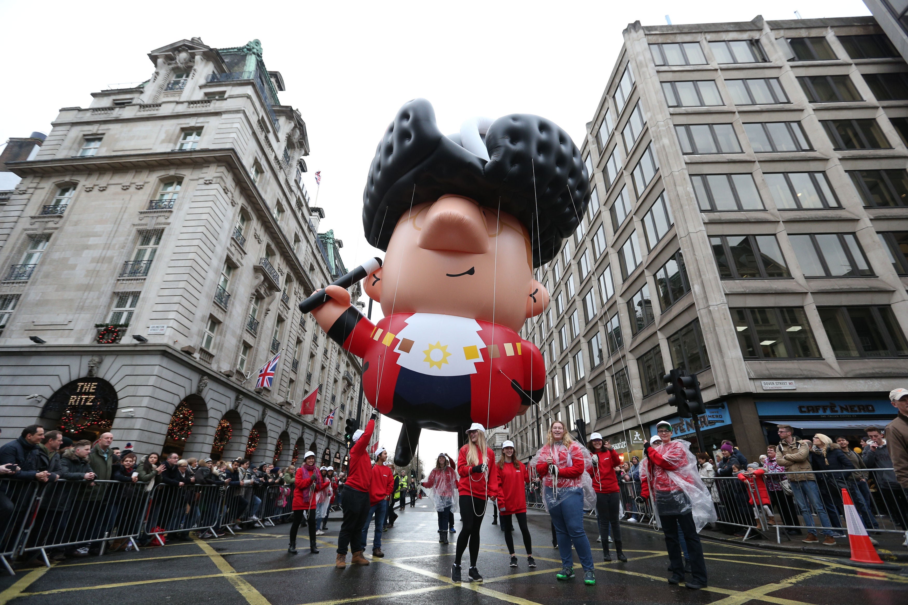 Participants in the 2017 New Year’s Day Parade hold an inflatable caricature of the Lord Mayor of London (Jonathan Brady/PA)