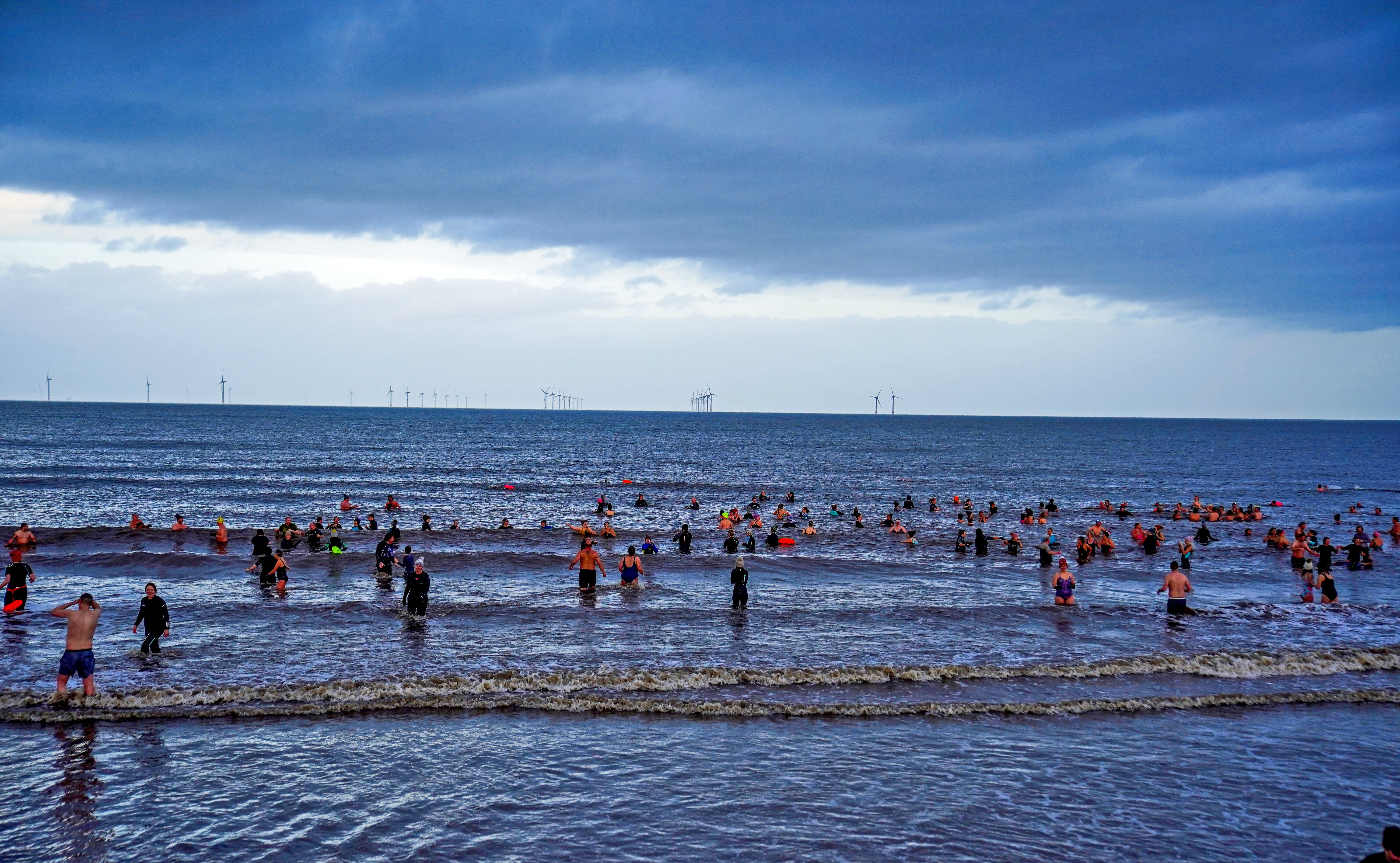 Dozens took to the water on a calm New Year’s Day morning (Peter Byrne/PA)