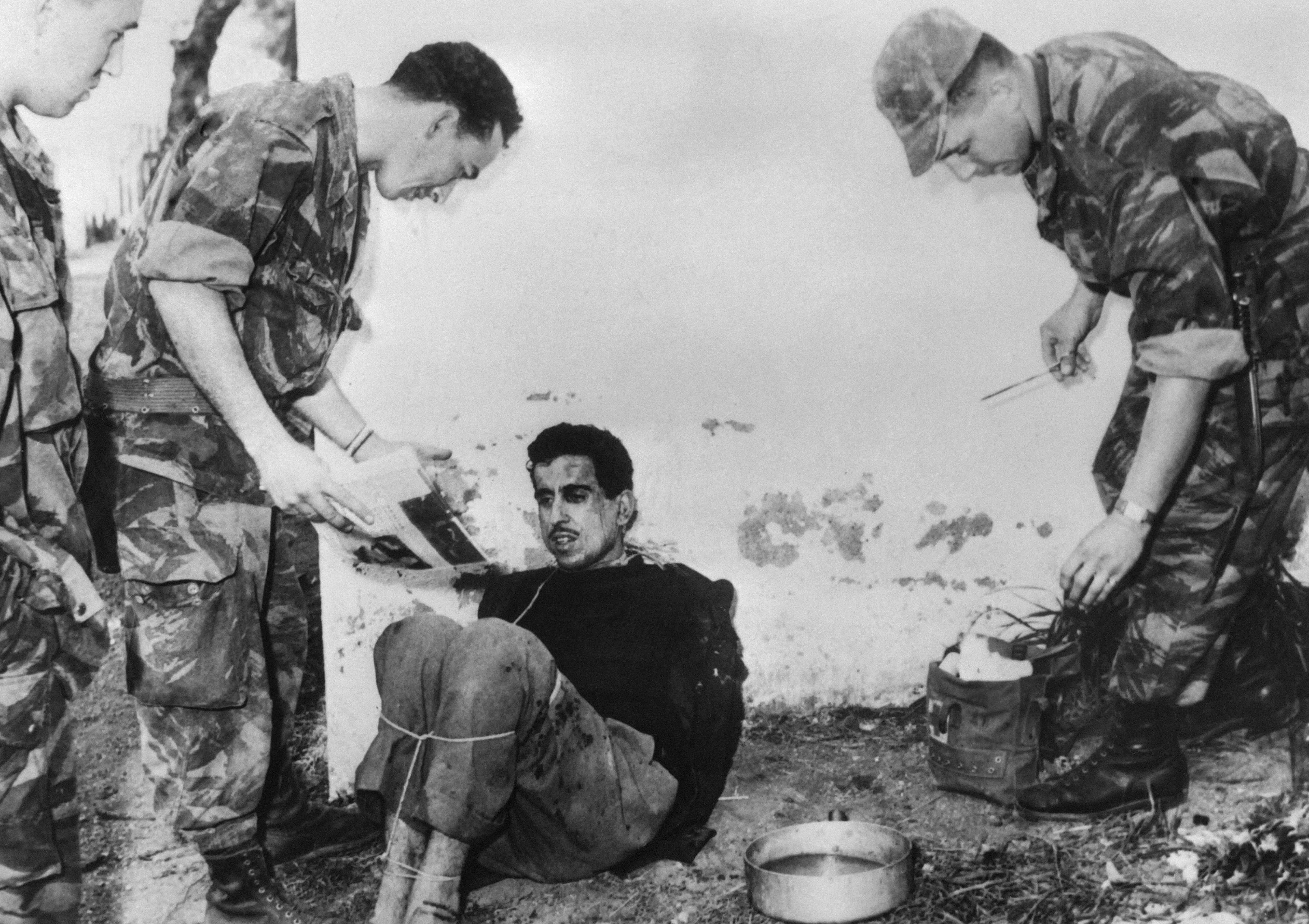 French paratroopers interrogate suspected attacker Omar Merrouane during Algeria’s war for independence in 1957