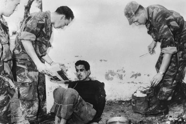French paratroopers interrogate suspected attacker Omar Merrouane during Algeria’s war for independence in 1957