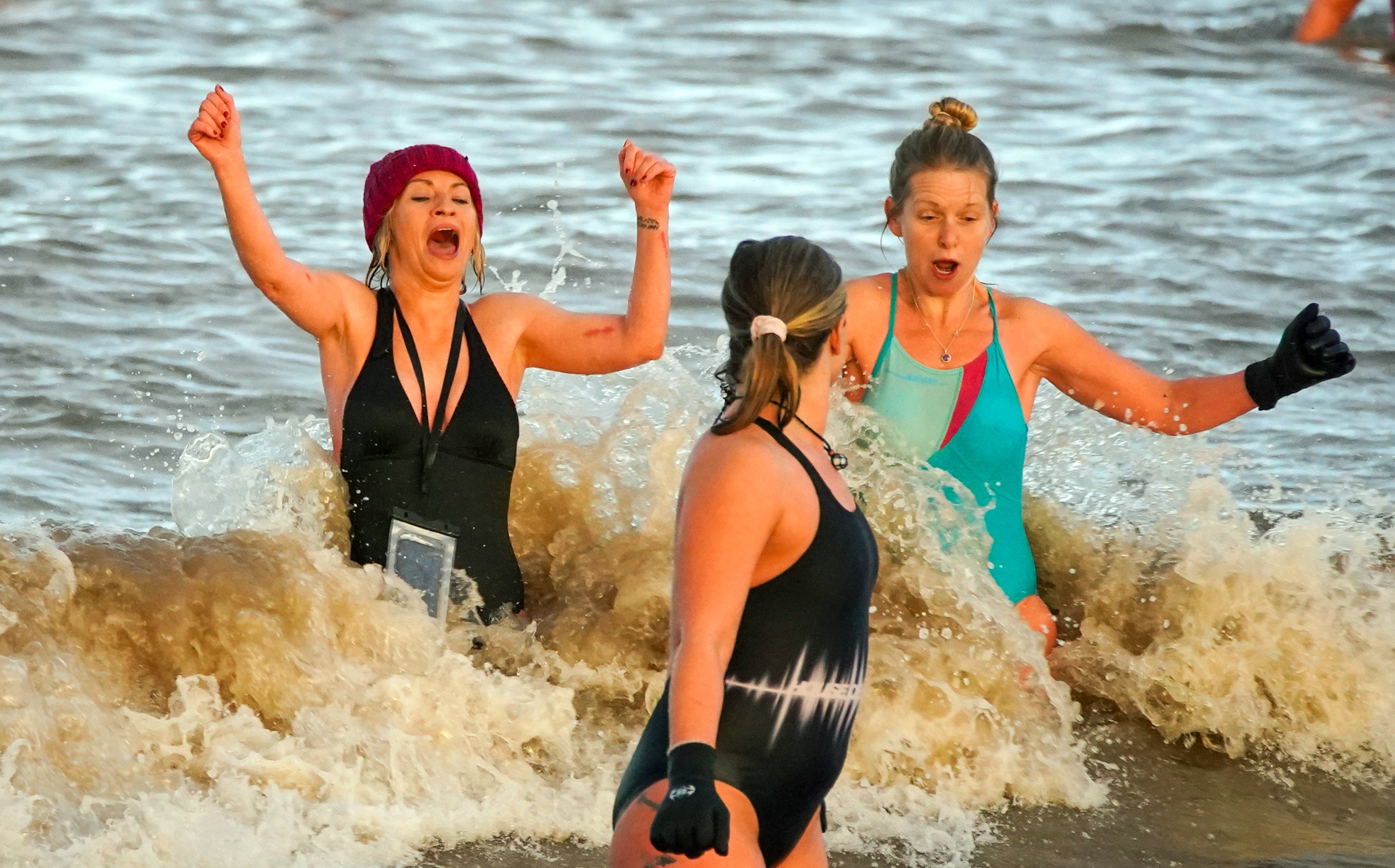 Swimmers take part in the New Year’s Day swim at Derby Pool, New Brighton, Wirral (Peter Byrne/PA)
