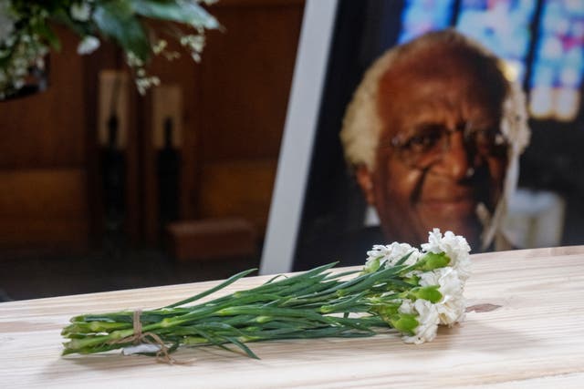<p>Flowers are laid over the coffin of the late Archbishop Desmond Tutu during the state funeral at St George’s Cathedral in Cape Town</p>