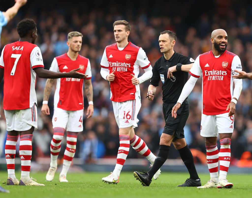 Bukayo Saka of Arsenal about to be shown a yellow card during the match against Manchester City on Saturday