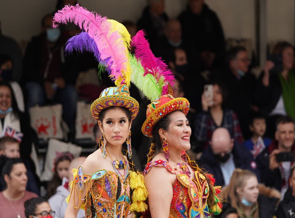 Bolivian cultural dancers wait to perform at London’s New Year’s Day concert in Waterloo Place (Stefan Rousseau/PA)