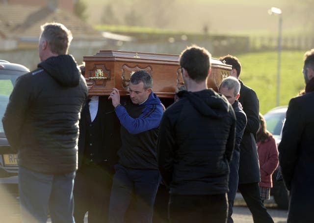 The coffin of Peter Alexander Finnegan being carried into St Patrick’s Church, Clogher, Co Tyrone (Oliver McVeigh/PA)