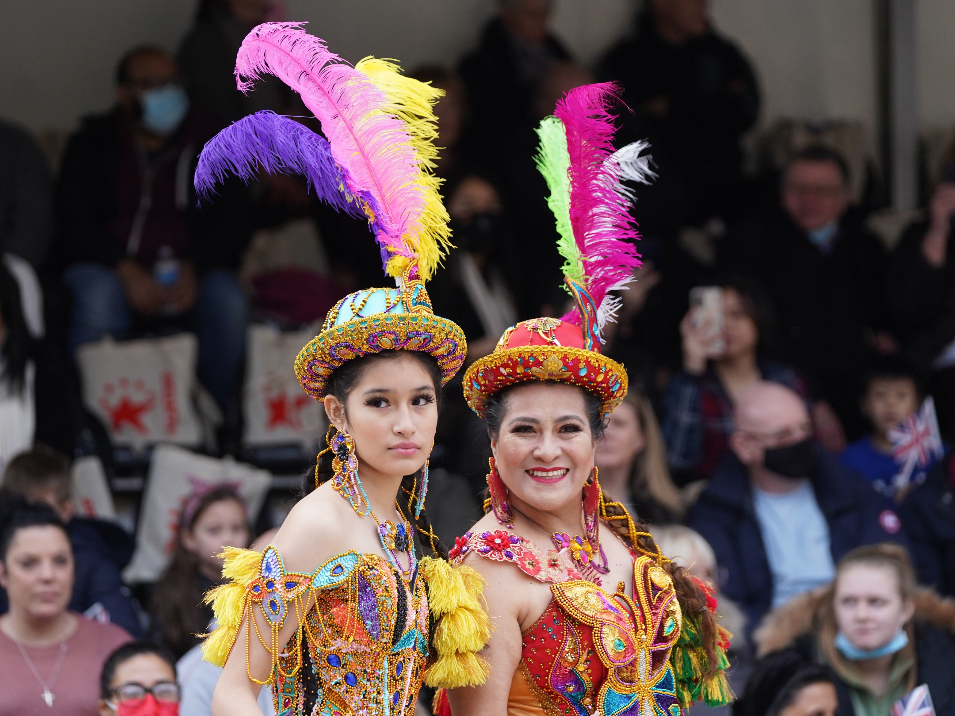 Bolivian cultural dancers wait to perform at London’s New Year’s Day parade in Waterloo Place, London