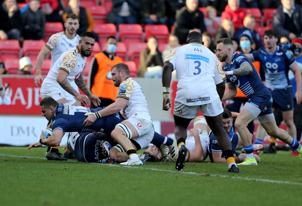 Rohan Janse van Rensburg dives over the line to score a try for Sale Sharks