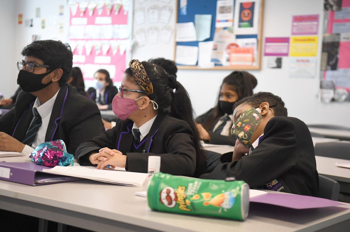 Covid UK news – live: Masks in classrooms return, amid fears quarter of workers may be off sick with Omicron