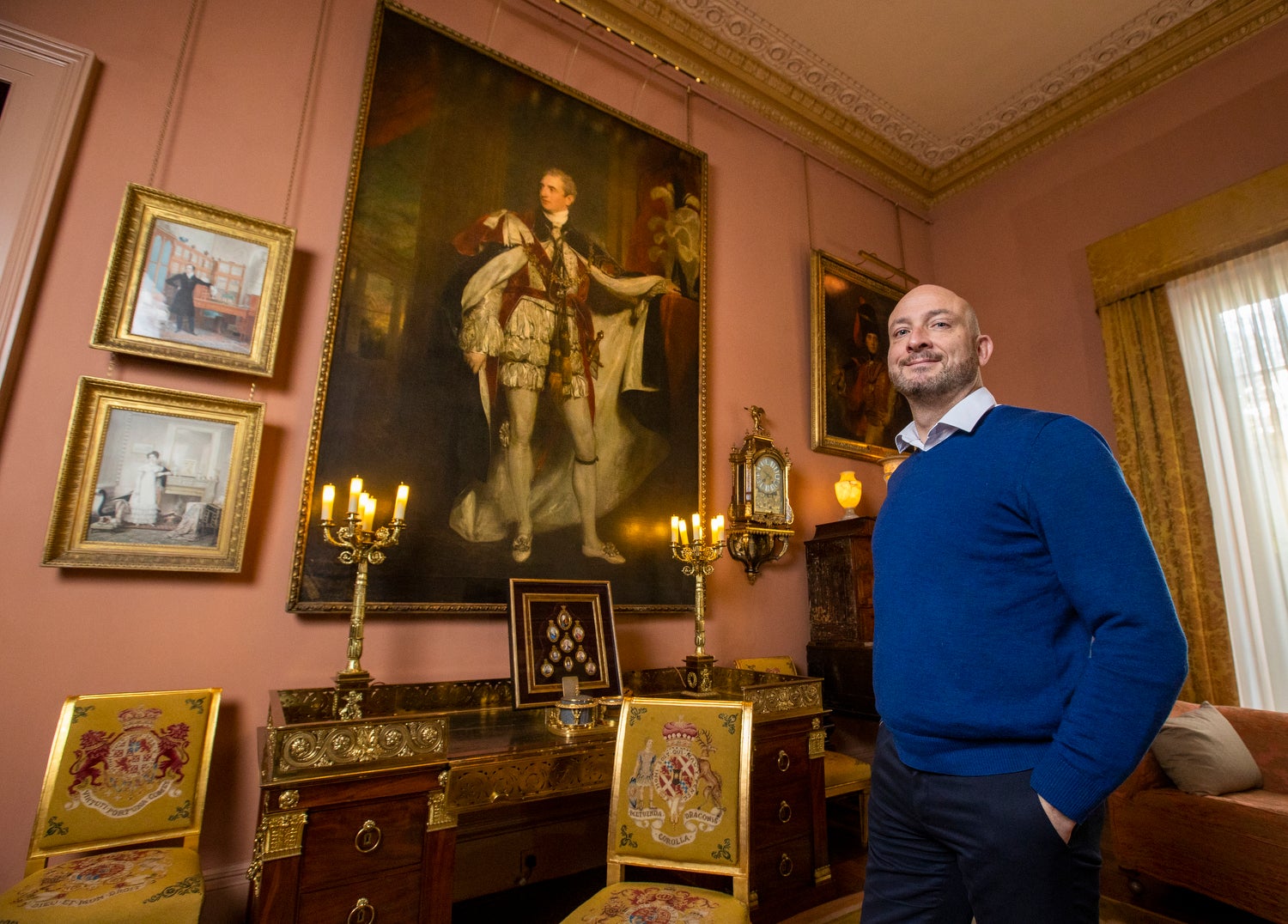 Dr Christopher Warleigh-Lack, National Trust Property Curator for east Down based at Mount Stewart, stands beside a portrait in Mount Stewart of Robert Stewart, 2nd Marquess of Londonderry (Lord Castlereagh,) by Sir Thomas Lawrence (Liam McBurney/PA)