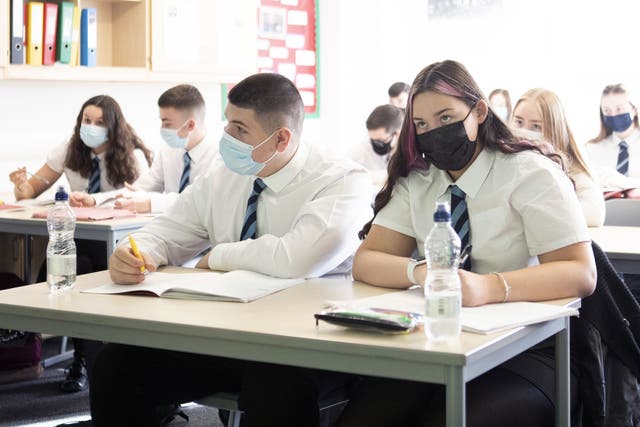 Secondary school children are being asked to wear masks in classrooms again to curb the spread of Covid (Jane Barlow/PA)