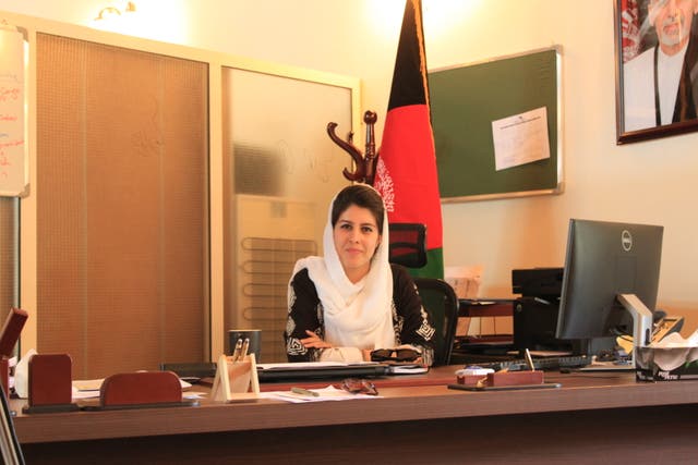 <p>Tamana Safi in her previous job in Kabul’s presidential palace </p>