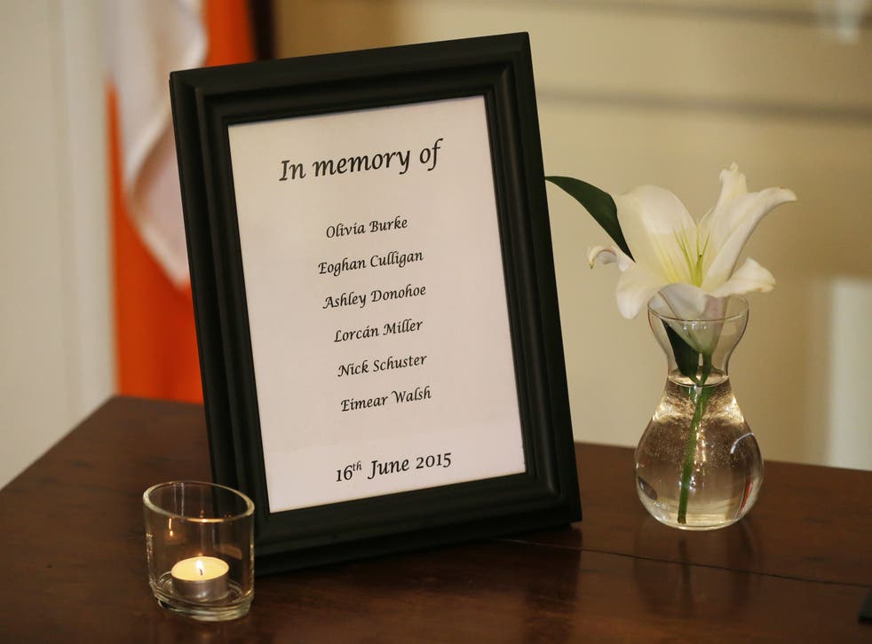 A list of the names of the victims beside a book of condolence at Mansion House in Dublin opened in memory of those killed in the Berkeley balcony collapse (Niall Carson/PA)