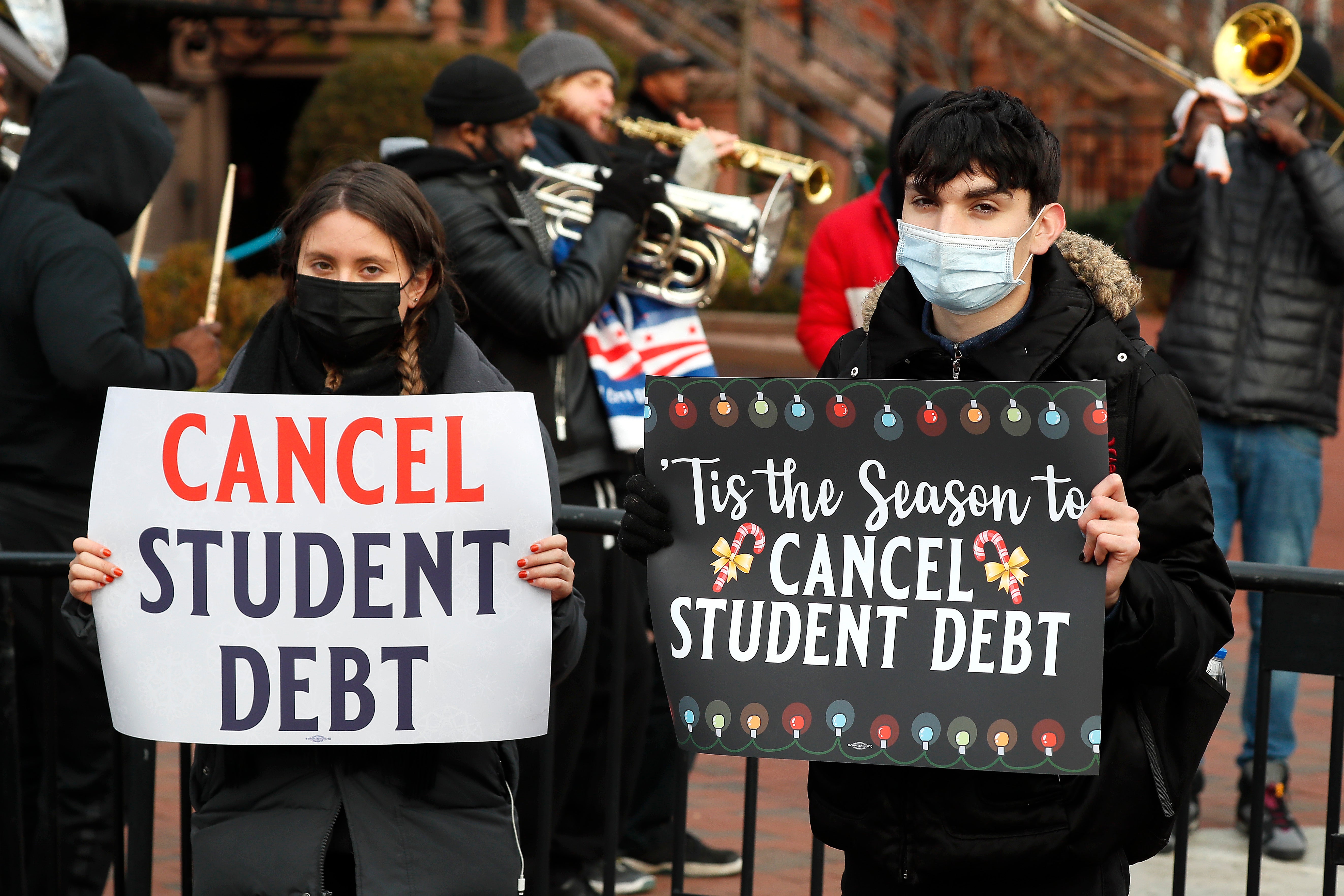 Advocates for student loan debt cancellation rallied outside the White House on 15 December. Joe Biden has extended a pause on repayments until May.