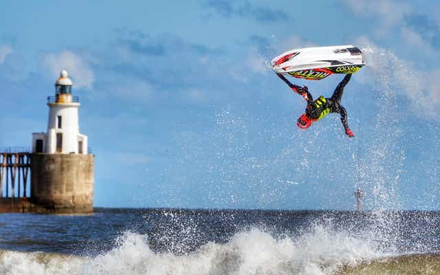 Ant Burgess practices his freestyle on a jet ski at Blyth beach in Northumberland (Owen Humphreys/PA)
