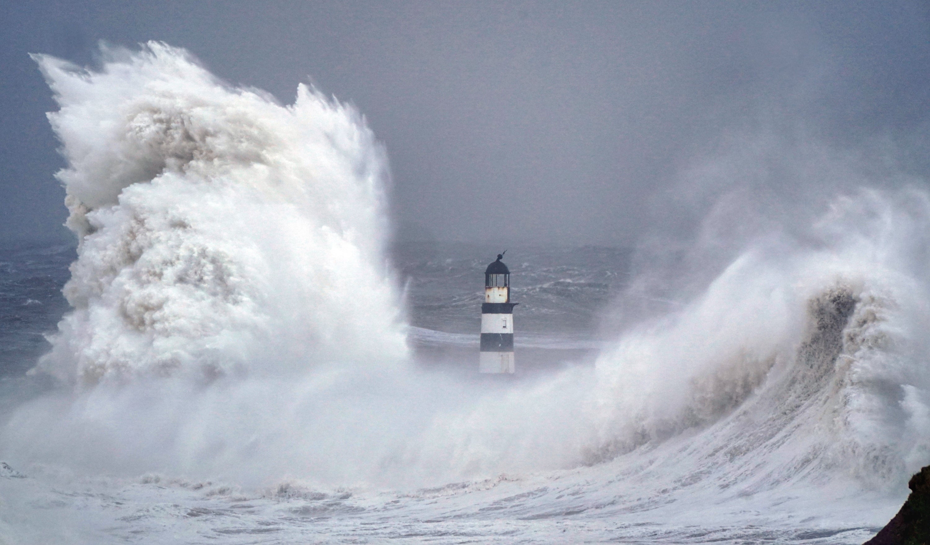 Huge waves crash against the lighthouse in Seaham Harbour, County Durham, during the tail end of Storm Arwen last November