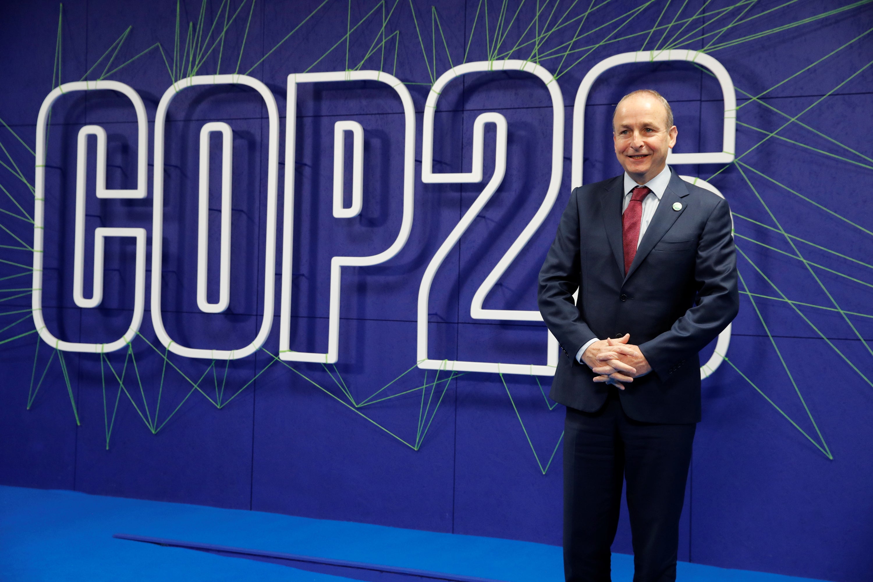 Taoiseach Micheal Martin arrives for the Cop26 summit at the Scottish Event Campus in Glasgow (PA)