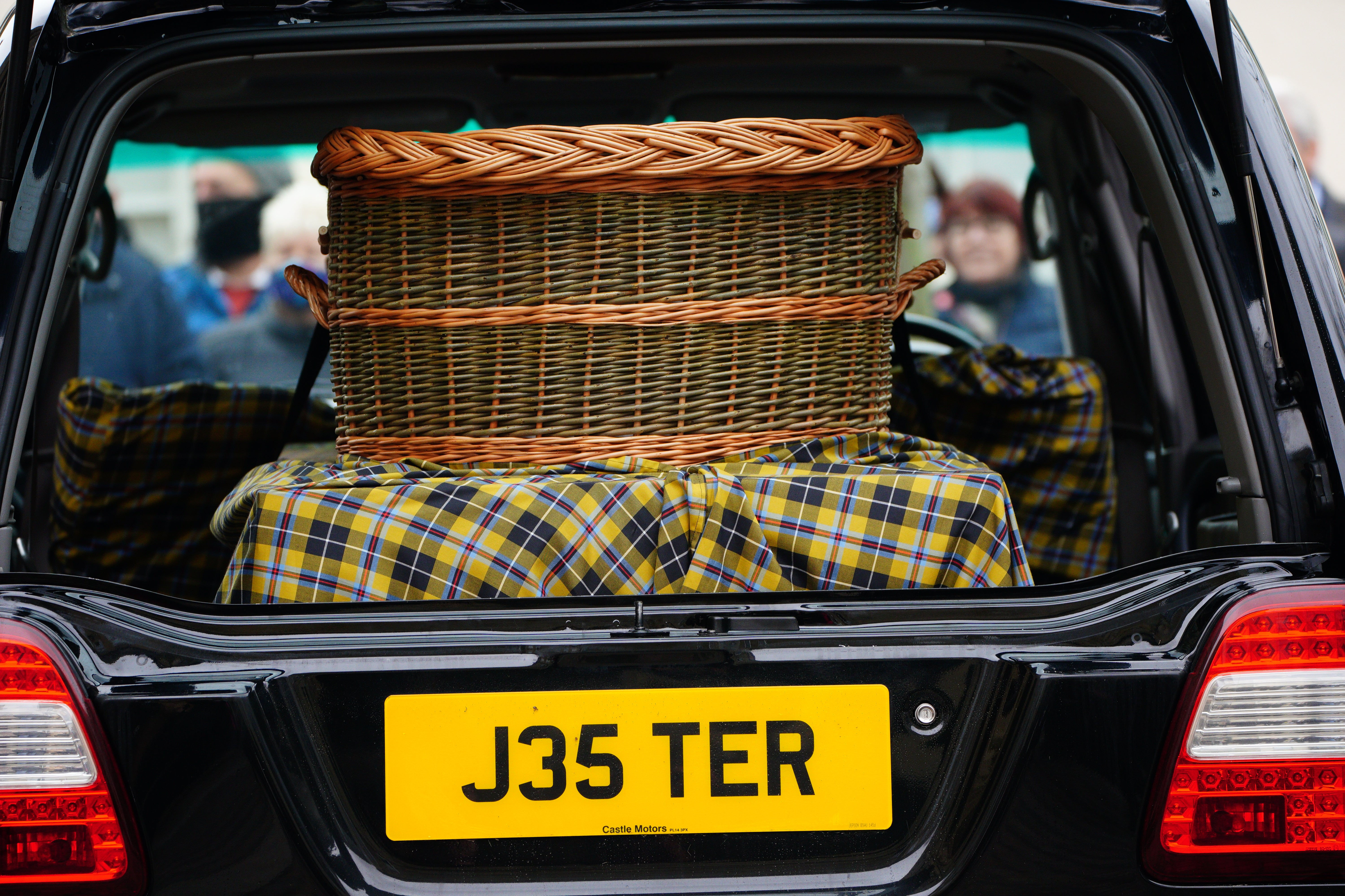 The car carrying the coffin, with personalised number plate J35TER, arrives for the funeral of Cornish comedian Jethro at Truro Cathedral in Cornwall. Jethro, real name Geoffrey Rowe, died on December 14 after contracting Covid-19 (Ben Birchall/PA)