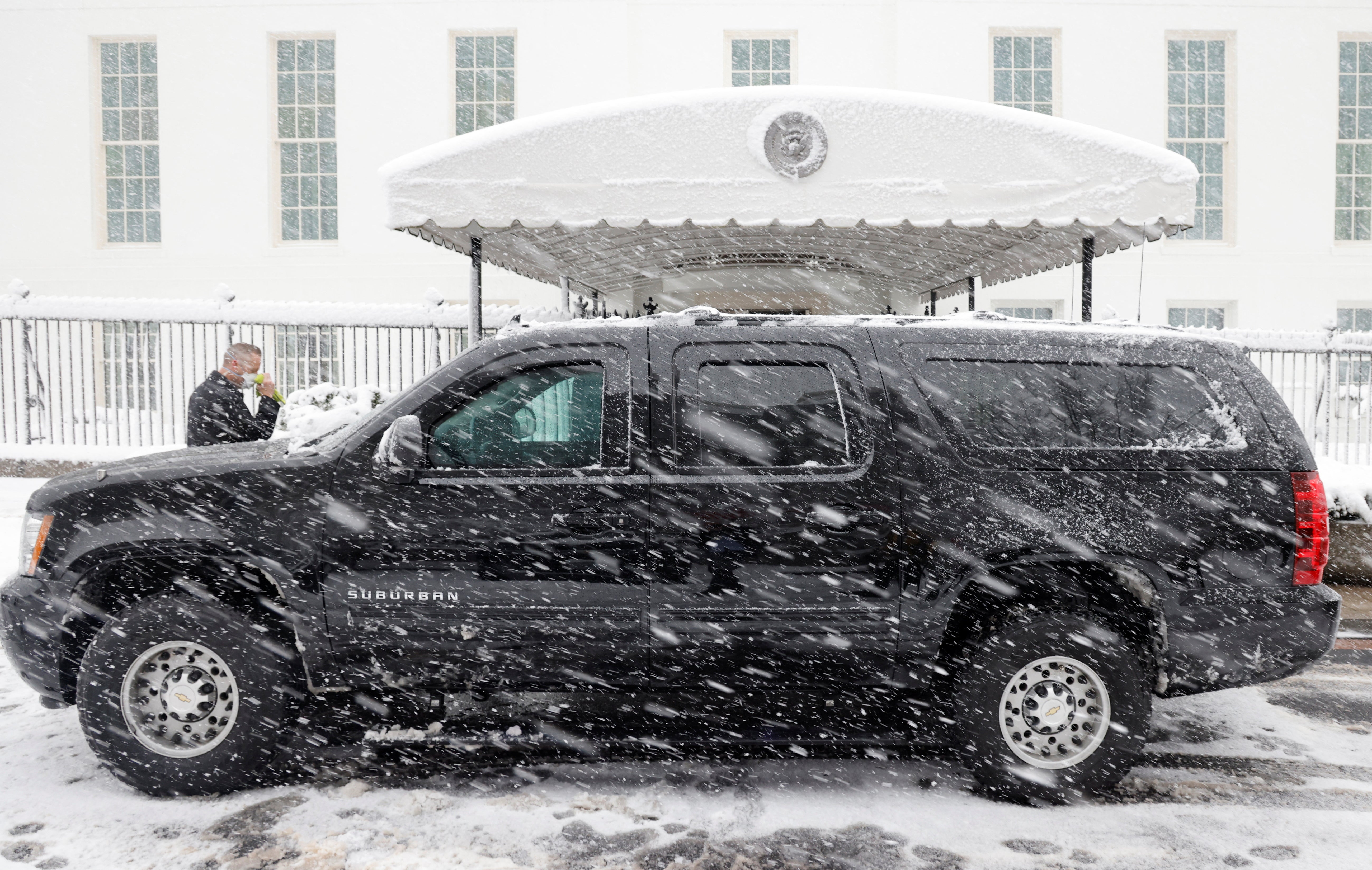 Joe Biden’s motorcade parks in the snow outside of the West Wing after delivering him from Joint Base Andrews to the White House in Washington, U.S., January 3, 2022