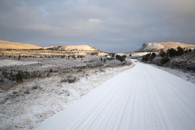 <p>Snow covers the B9007 between Carrbridge and Forres in the Cairngorms National Park</p>