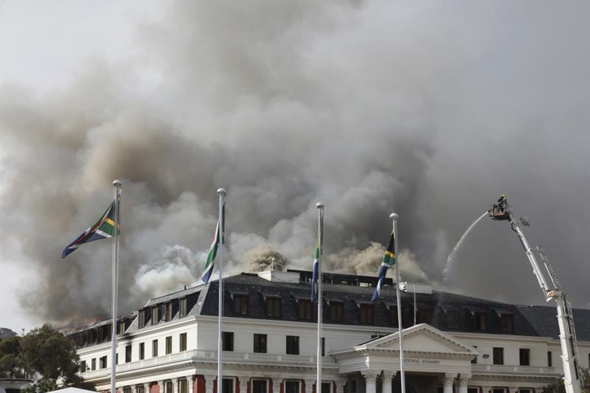 Firefighters battle fresh blaze at South Africa&rsquo;s parliament as suspect charged with arson